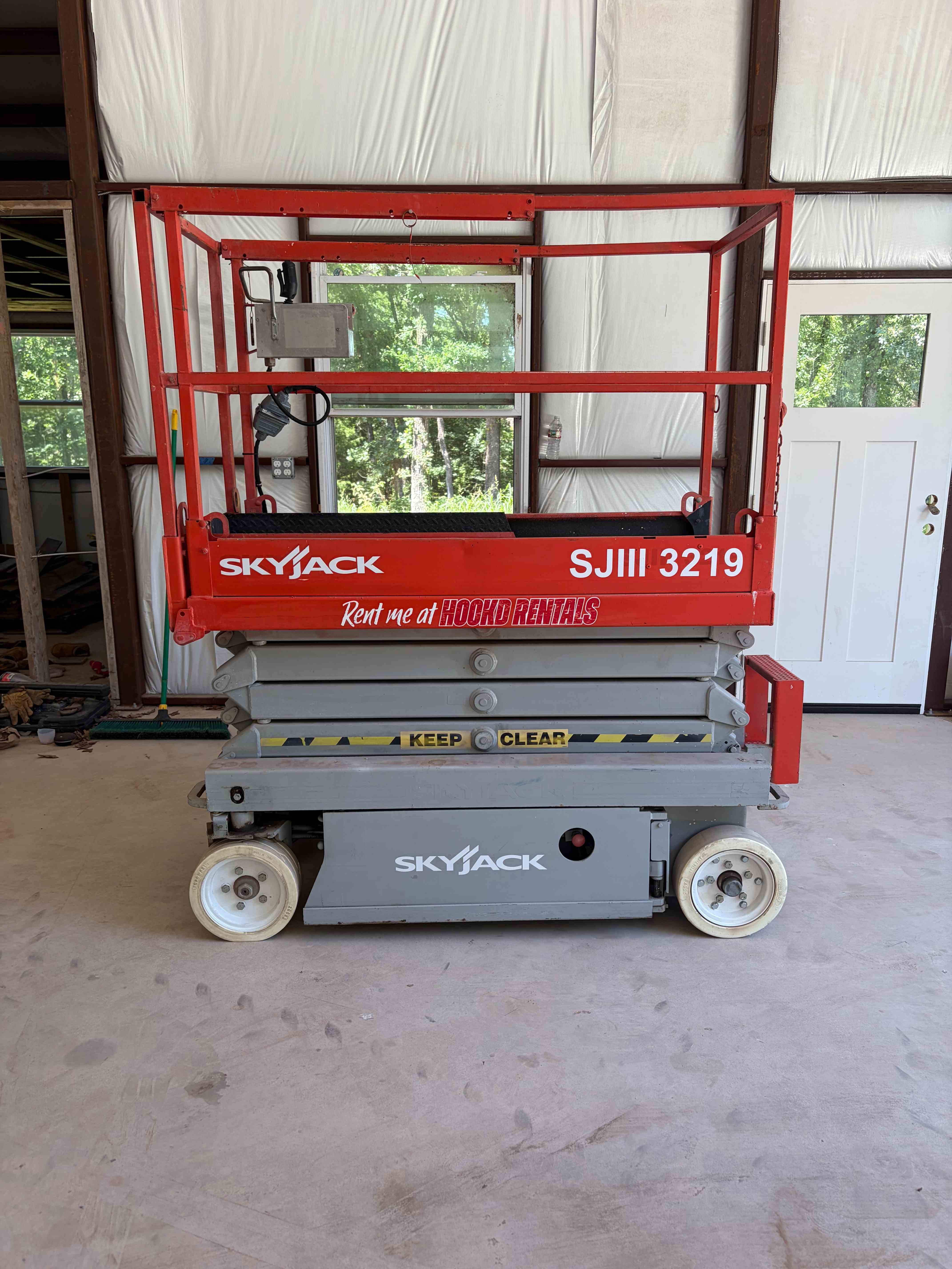 19' Scissor Lift available for rent - Electric scissor lift reaching 19ft — ideal for indoor and outdoor elevated work.